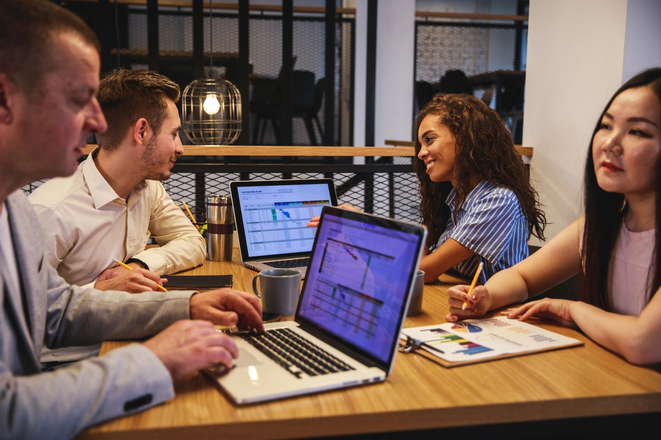 Business and technology partners meeting in a board room