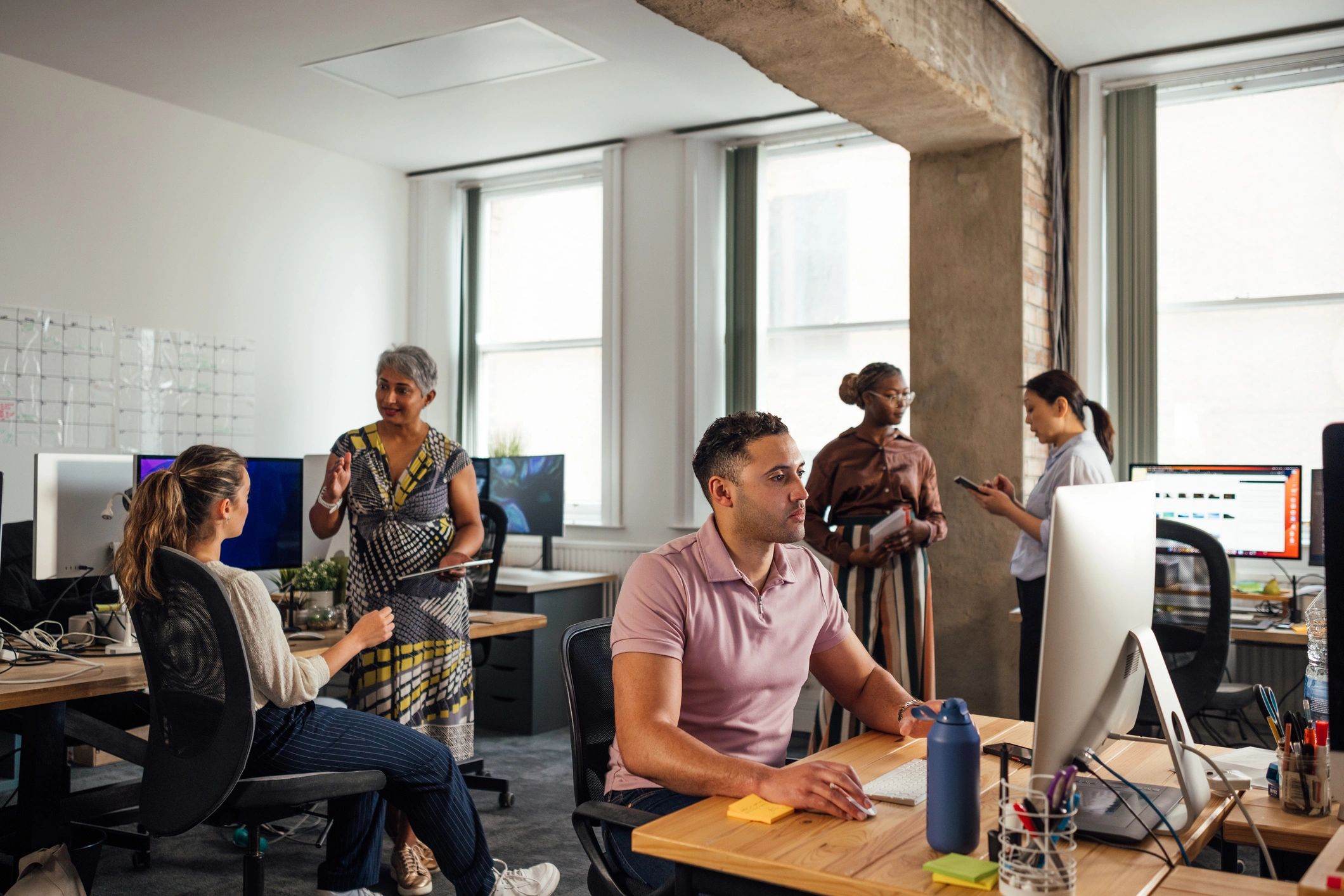 Technology professionals collaborating in an office